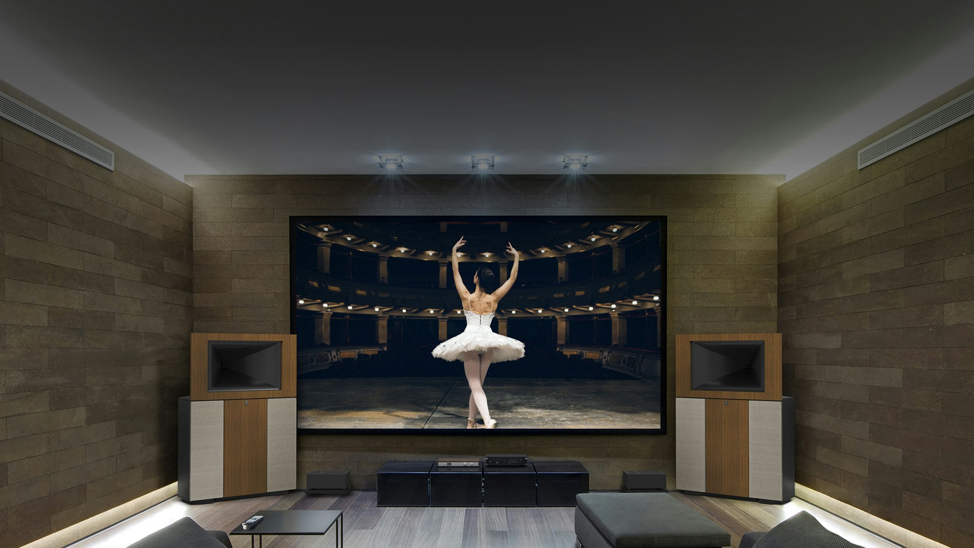 A pair of Klipsch Jubilees flanking a large TV with a ballerina on the screen